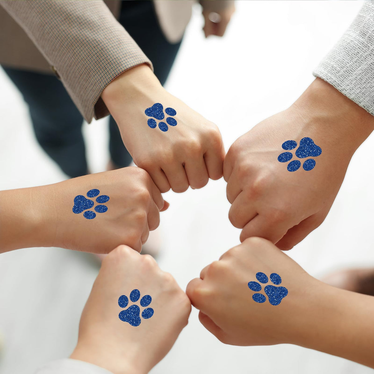 Jutom blue dog paw tattoo applied to forearm for daily wear.
