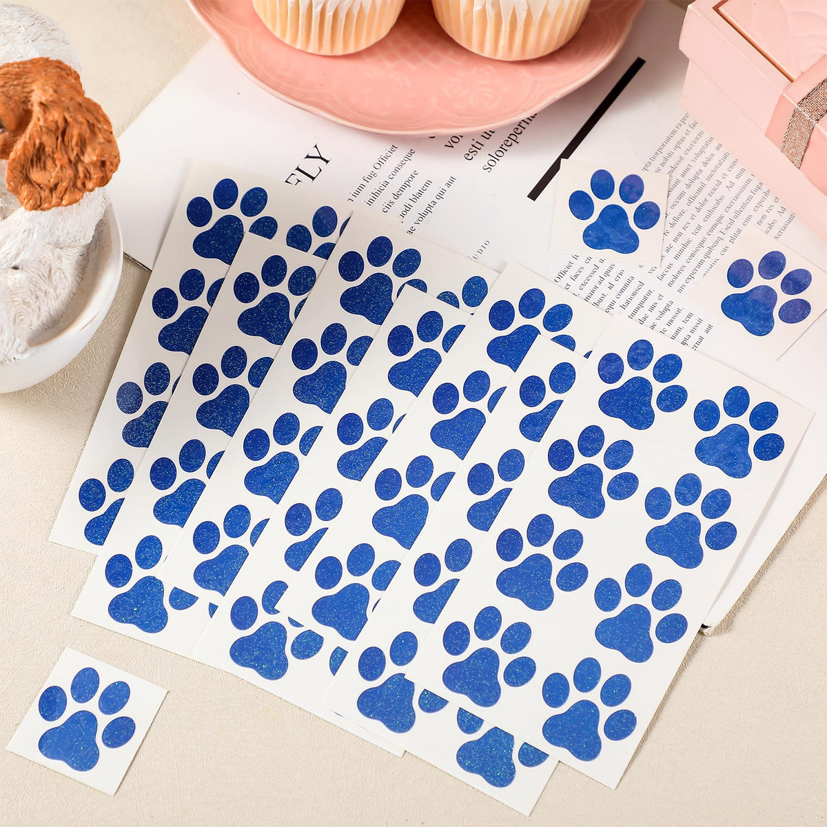 Jutom 30-sheet pack of blue dog paw tattoos ready for sharing.