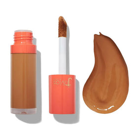 Juvia's Place I Am Magic concealer J10 Dark bottle close-up showing lightweight coverage.