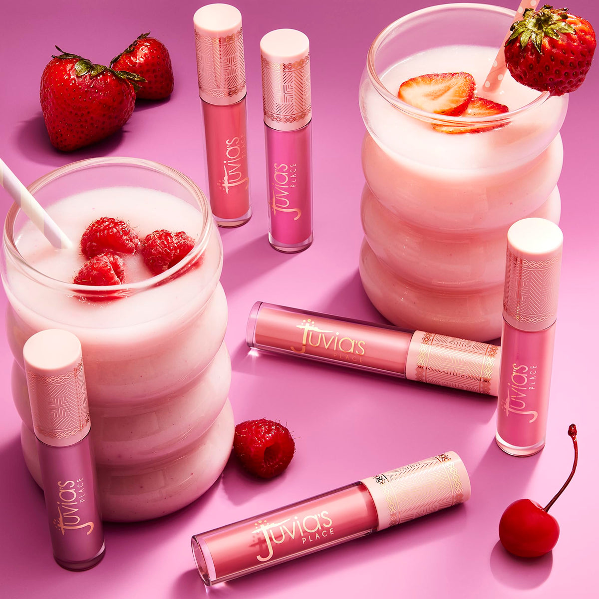 Close-up of Juvia's Place Smoothie Lip Gloss Pink Velvet on lips for shine.