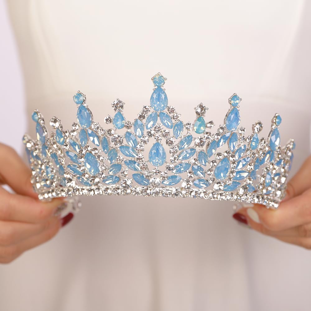 JWICOS blue rhinestone tiara shines under stage lighting.