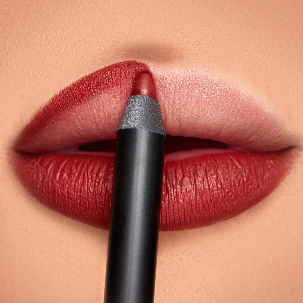 K7L Flame lip crayon swatch shows bold red-brown color with rich payoff.
