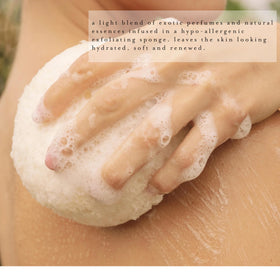 Kai Body Buffer gardenia scent imagery in bath showing fresh floral fragrance.