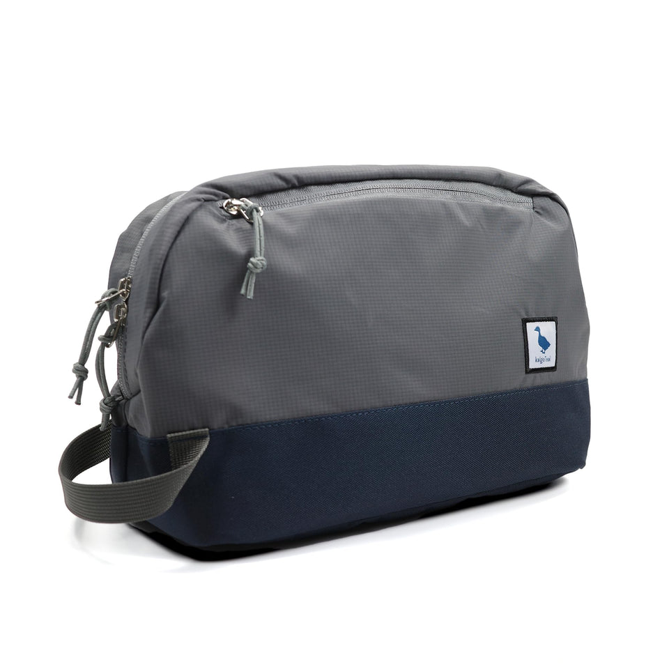 kalgoTeal travel toiletry bag 8L front pocket with a wet/dry TPU pocket for organization.