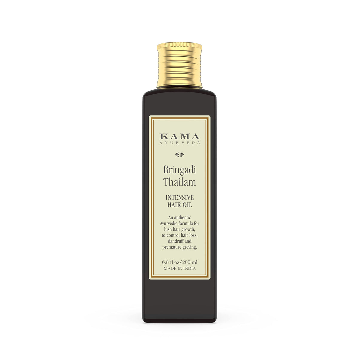 Kama Ayurveda Bringadi Tailam packaging closeup highlighting natural hair care benefits.