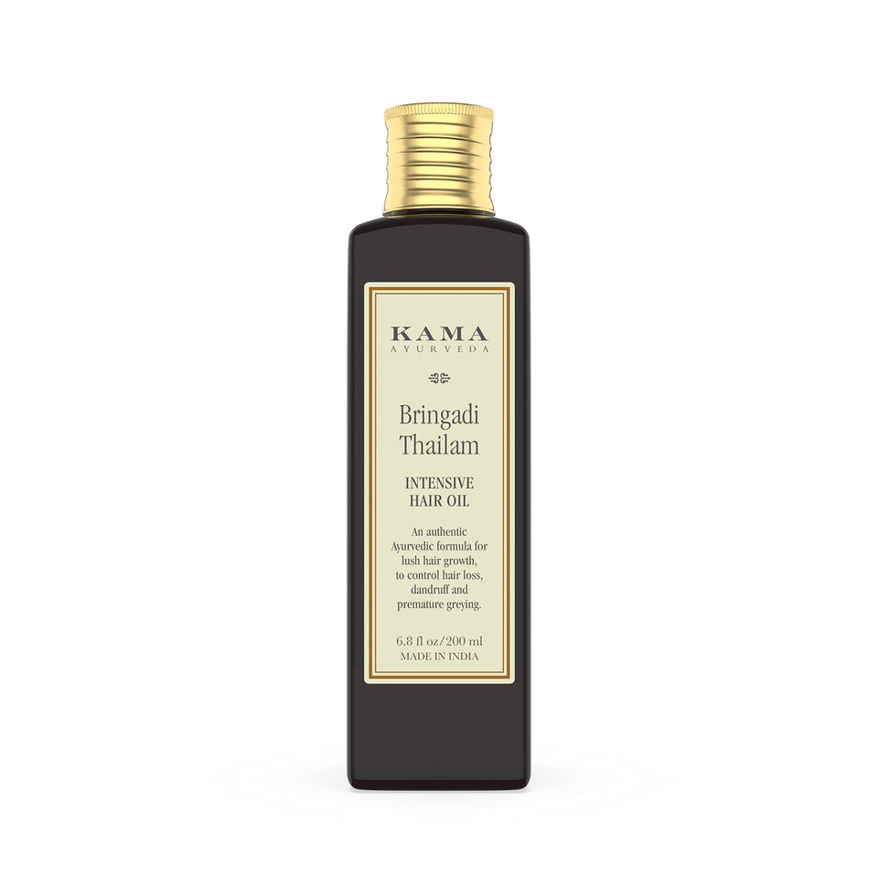 Kama Ayurveda Bringadi Tailam packaging closeup highlighting natural hair care benefits.