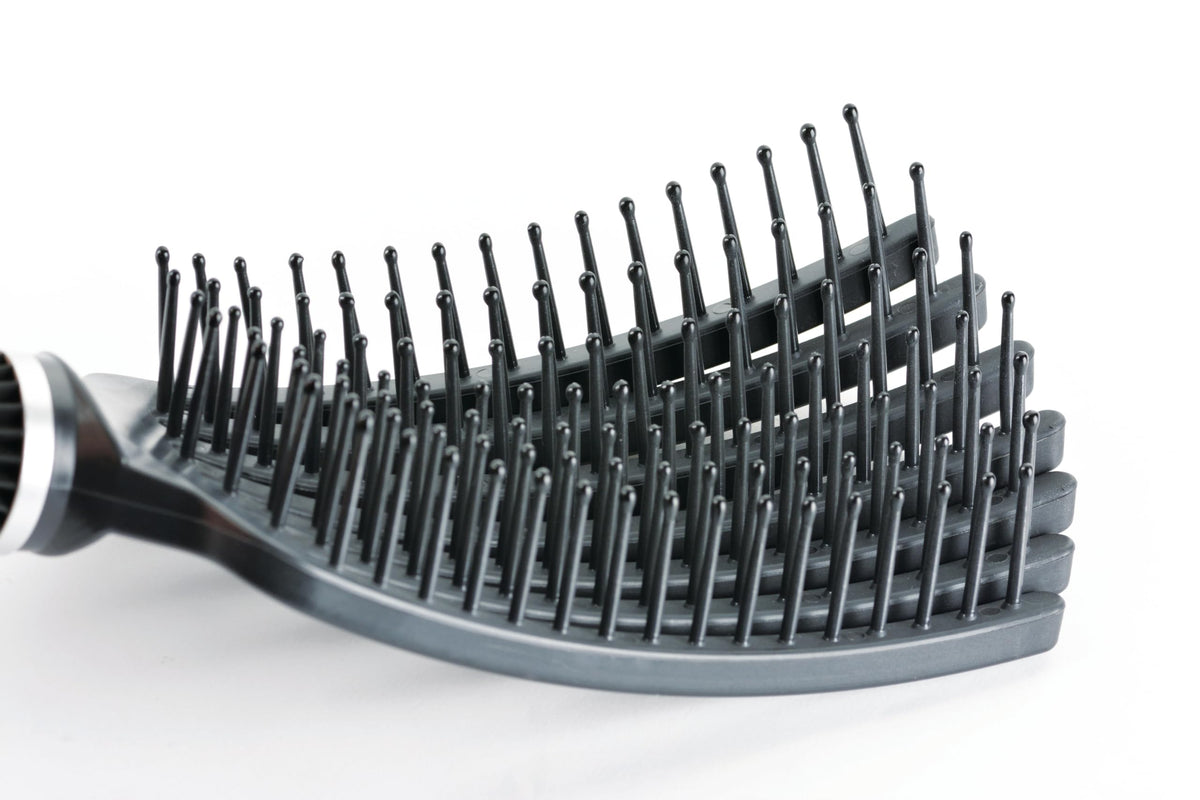 KareCo Tangle Buster mini travel black in bag ready for grooming anywhere