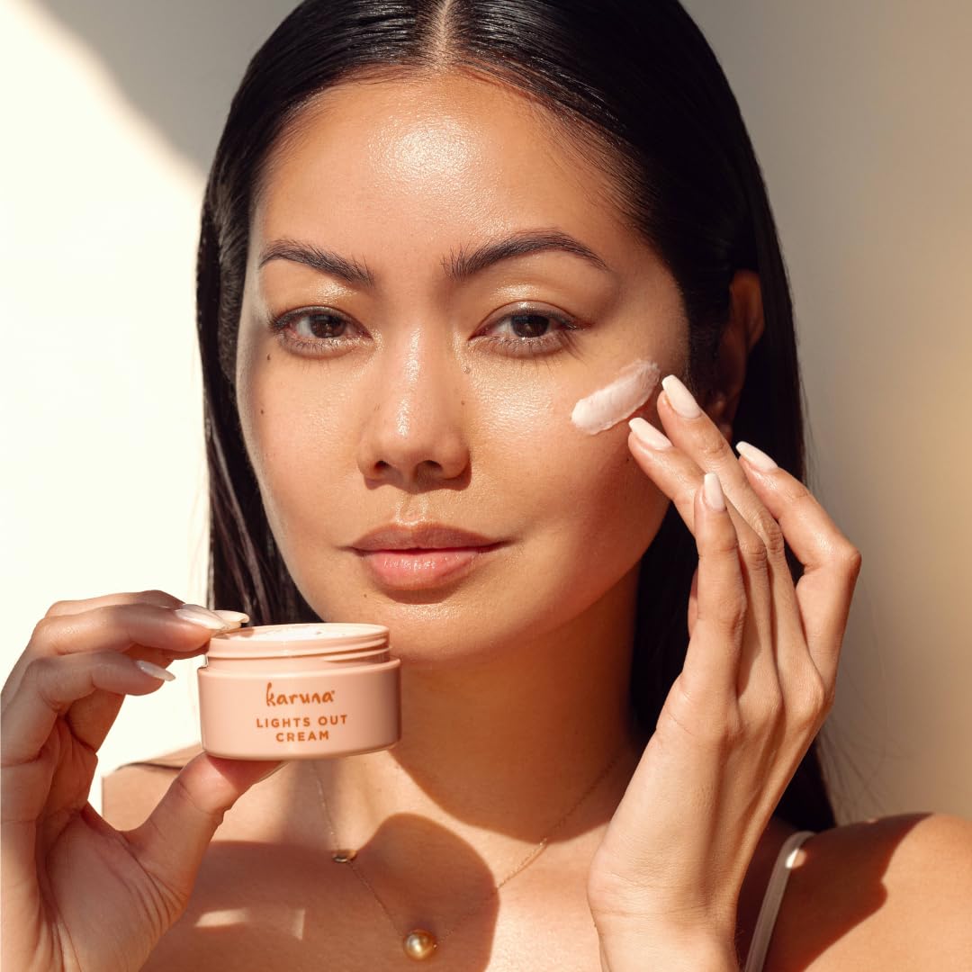 Karuna Lights Out Cream jar closeup shows rich, nourishing texture for night care.