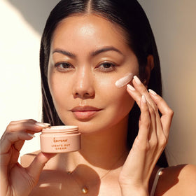Karuna Lights Out Cream jar closeup shows rich, nourishing texture for night care.