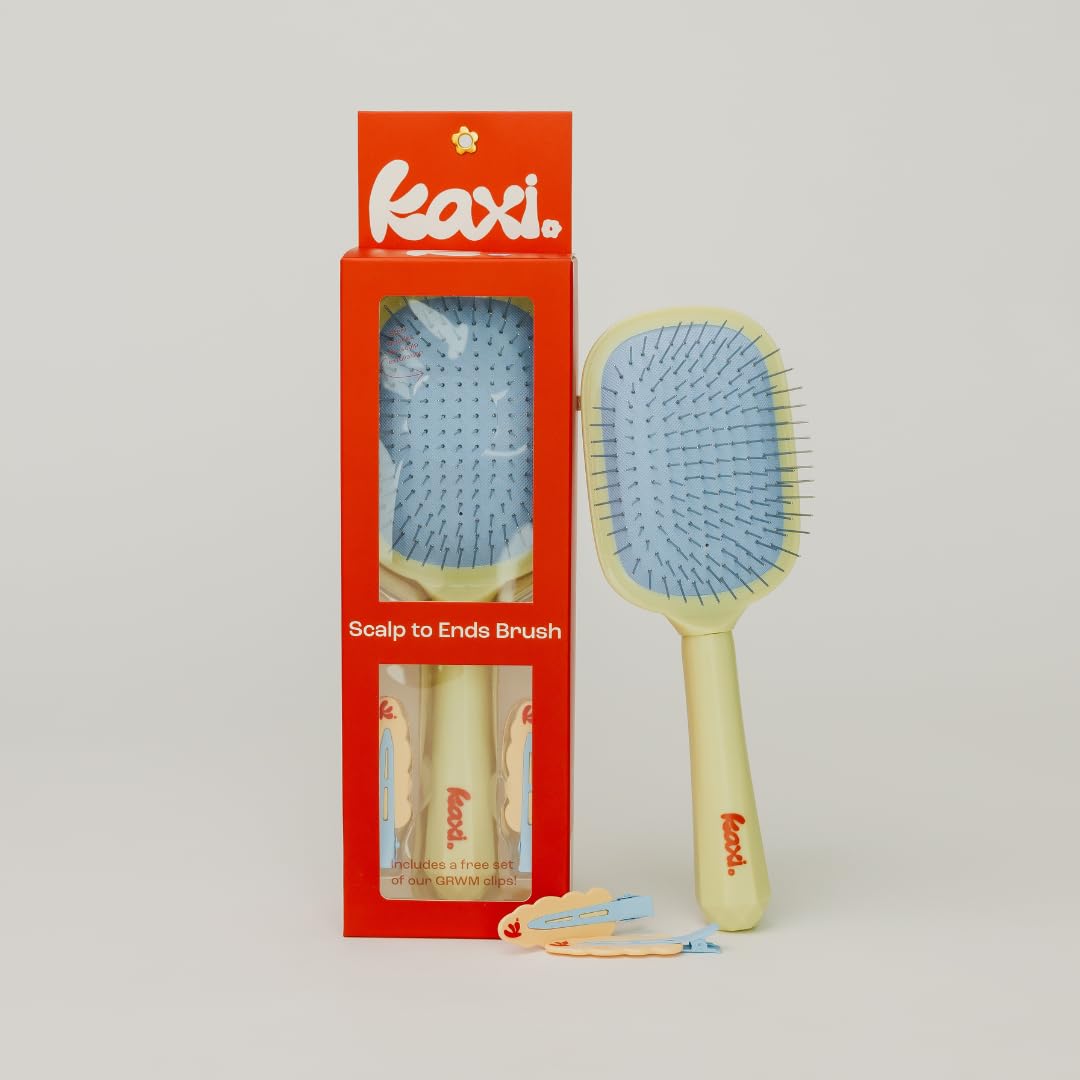 Kaxi Metal Bristle Scalp to Ends Brush glides through hair with ease.