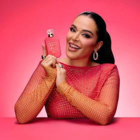 Side view of Kayali Eden Plush Pear 23 mini bottle with travel-friendly design