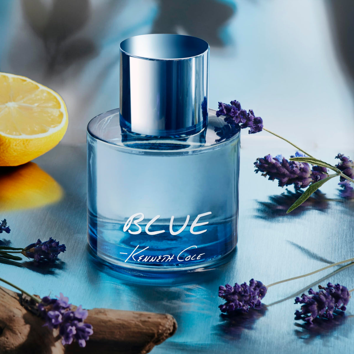 Kenneth Cole Blue EDT bottle side view with sleek silhouette and amber-cedar accents.