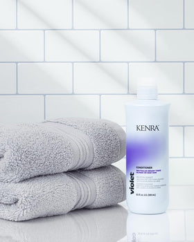 Kenra Violet set on vanity with shampoo and conditioner.