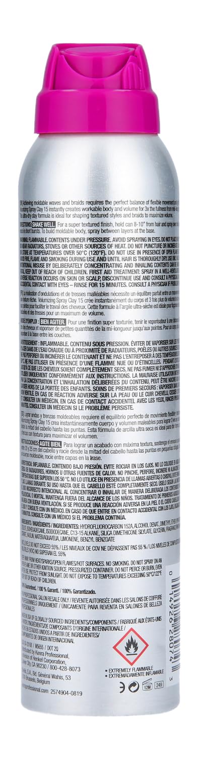 Applying Kenra Volumizing Spray Clay 15 for lift and texture.