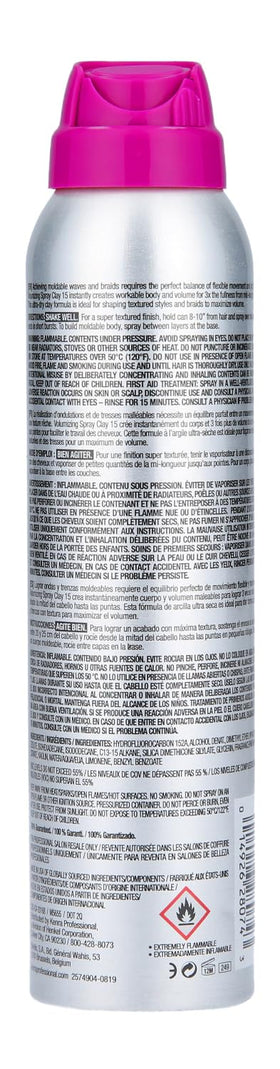 Applying Kenra Volumizing Spray Clay 15 for lift and texture.