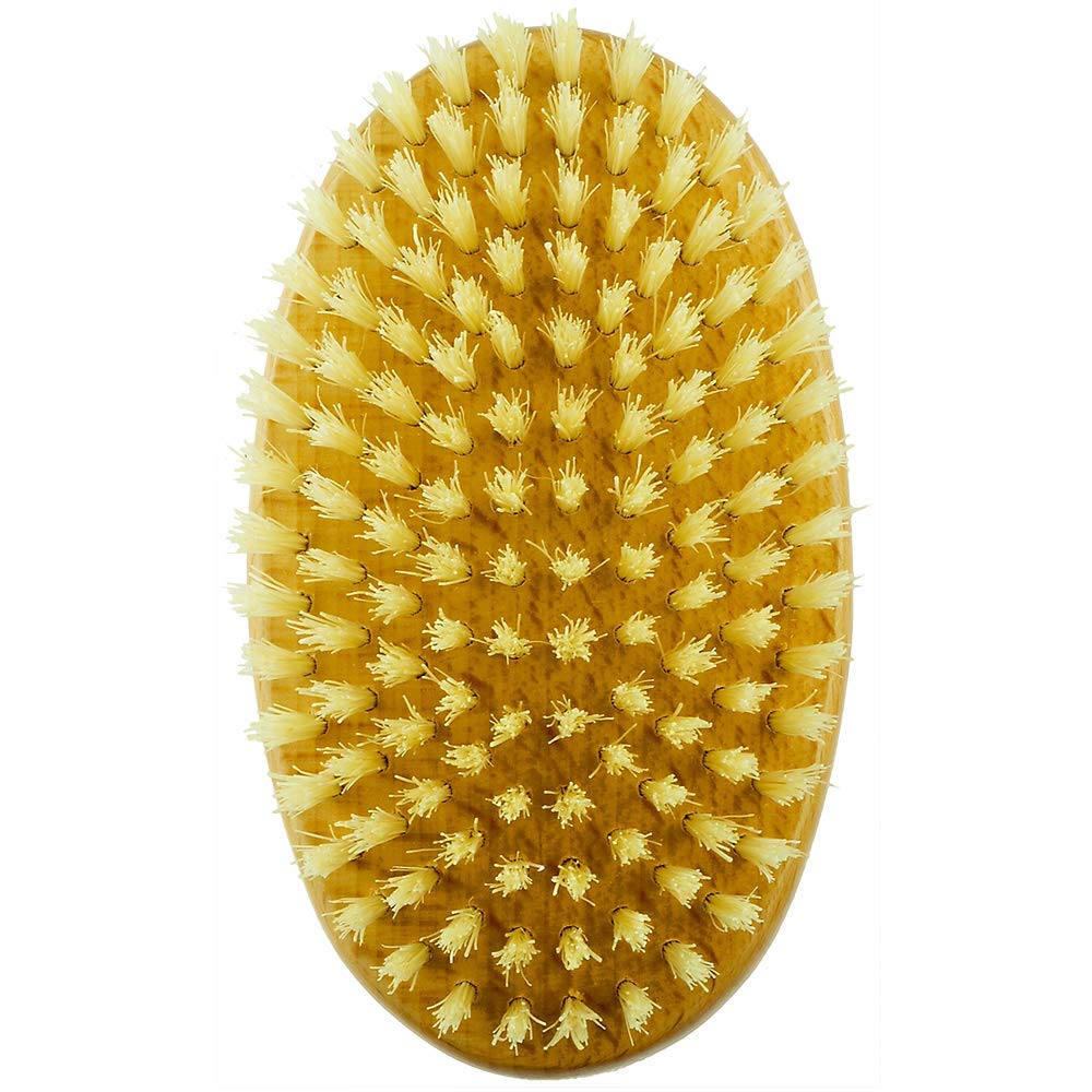 Kent MG3 Finest travel size brush in hand for on the go grooming