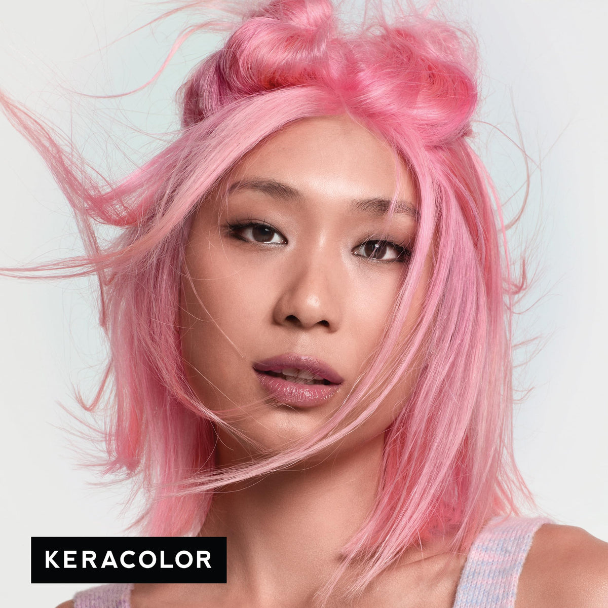 Keracolor Light Pink hair-conditioning application for smooth shine.