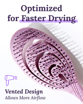 Keranique flexible paddle design adapts to head contours for comfortable detangling.