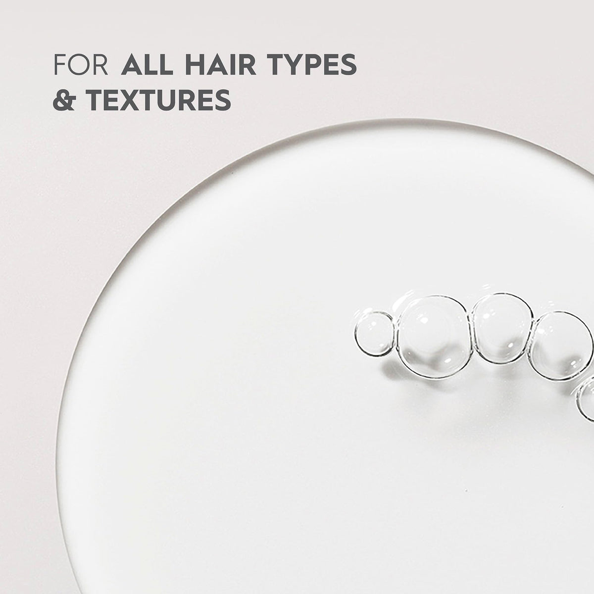 KERASILK Multi-Benefit Hair Oil packaging display highlighting vegan formula for all hair types.