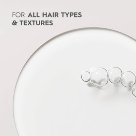 KERASILK Multi-Benefit Hair Oil packaging display highlighting vegan formula for all hair types.