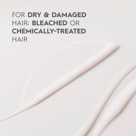 Kerasilk Restorative Balm application on hair ends for smoother feel