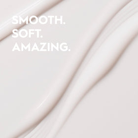Kerasilk Taming Balm bottle closeup shows smooth results and heat protection
