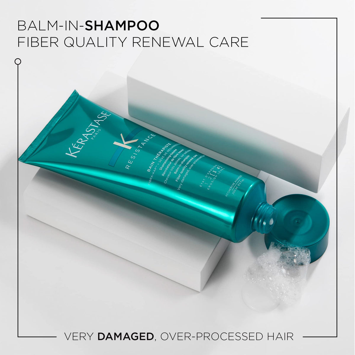 Kérastase Bain Therapiste shampoo lather closeup emphasizing gentle cleansing and protection