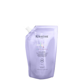 Kérastase Blond Absolu Lumière shampoo bottle delivers hydrating care for highlighted hair.