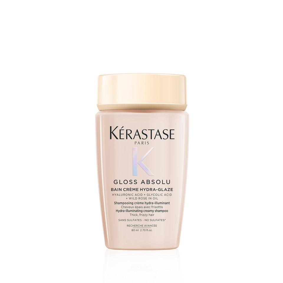 Kérastase Gloss Absolu bottle pour showing anti-frizz and shine potential.