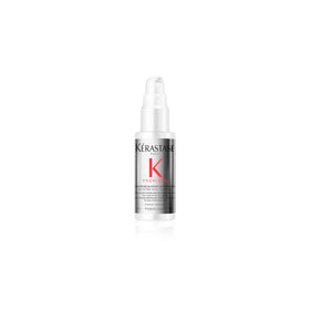 KÉRASTASE Premiere Repair bottle pour demonstrates dual-action repair for stronger hair.