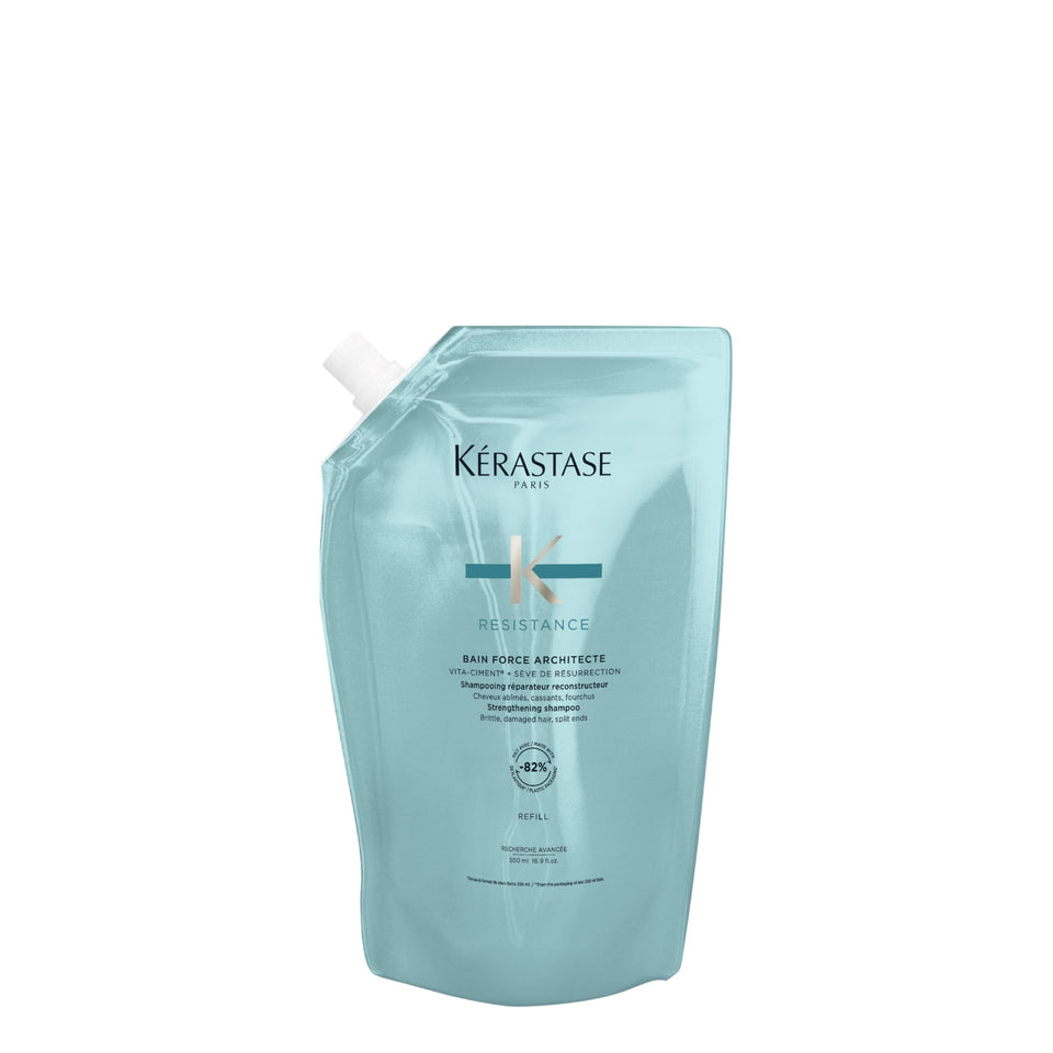 KÉRASTASE Resistance Force Architecte Shampoo bottle on shelf for damaged hair repair.