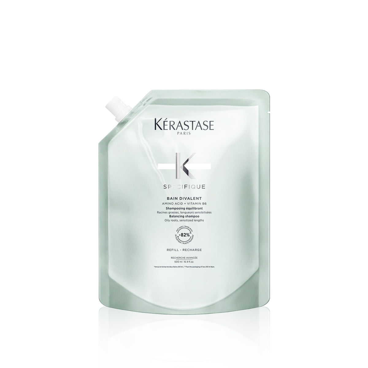 KÉRASTASE Specifique Balancing Shampoo Refill bottle pouring to cleanse oily roots.