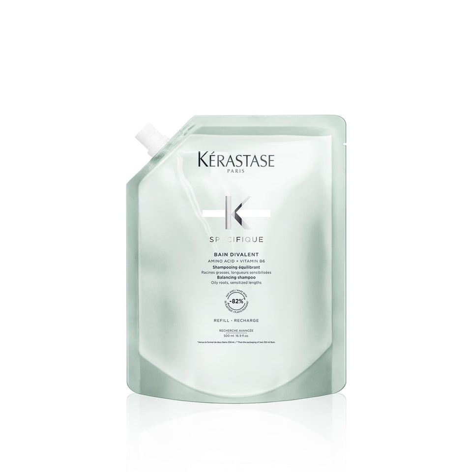 KÉRASTASE Specifique Balancing Shampoo Refill bottle pouring to cleanse oily roots.