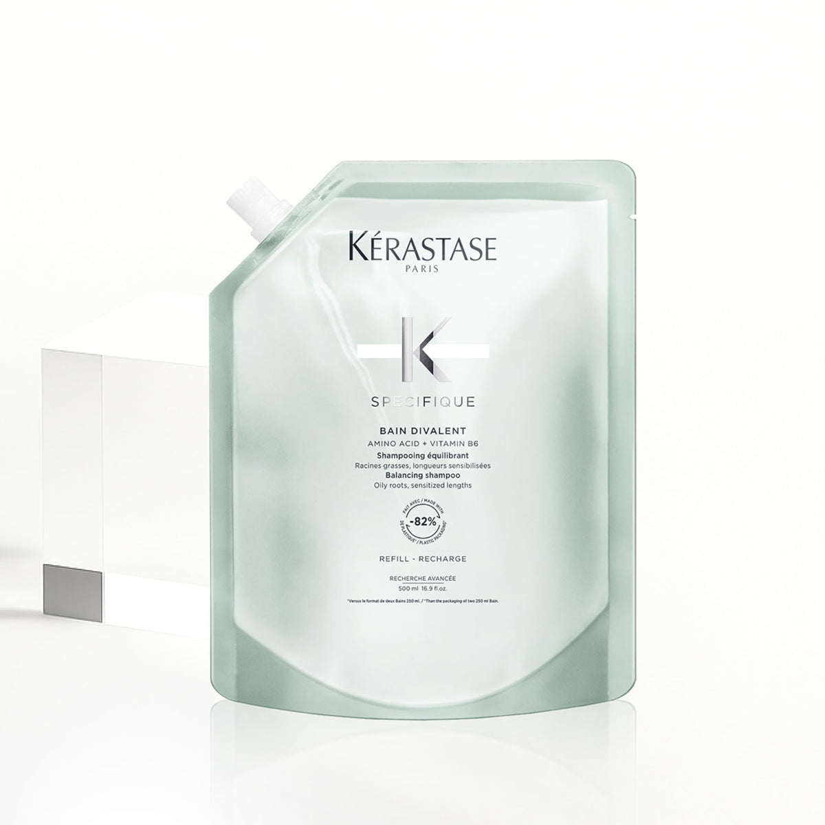 KÉRASTASE Specifique bottle with foam, balanced oil and moisture.