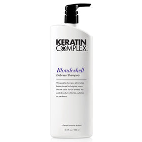 Keratin Complex Blondeshell Debrass Shampoo bottle neutralizes brass on color-treated hair.