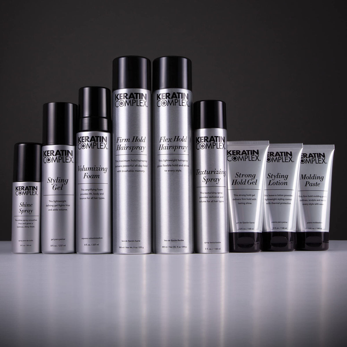 Close-up of Keratin Complex Shine Spray bottle highlighting sun protection features for color and gloss.