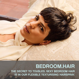 KEVIN.MURPHY BEDROOM.HAIR spray application demonstrates even distribution for effortless styling.