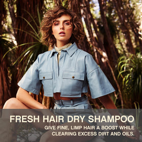 Close-up of KEVIN.MURPHY FRESH.HAIR spray applying to roots for instant refresh
