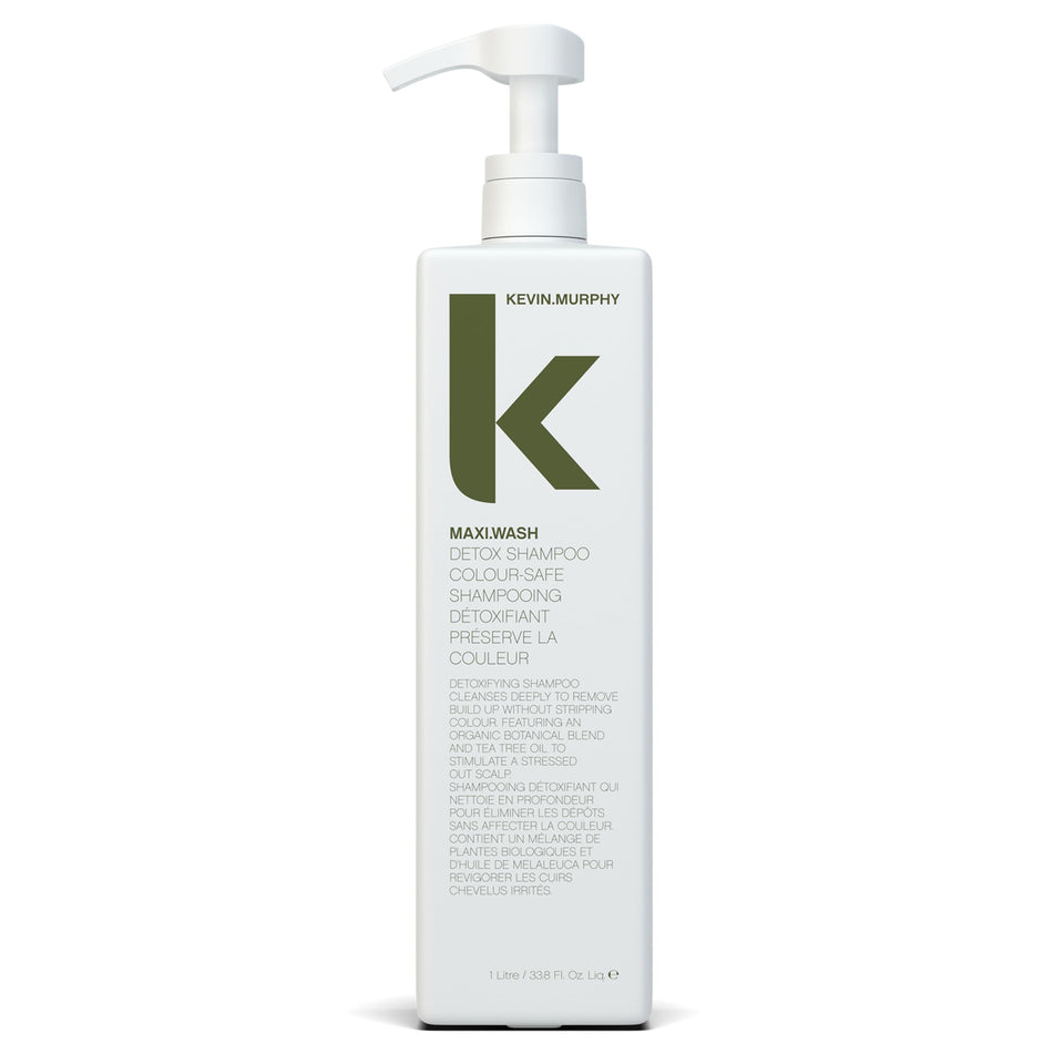 KEVIN.MURPHY MAXI.WASH detox bottle pours to cleanse buildup on hair.