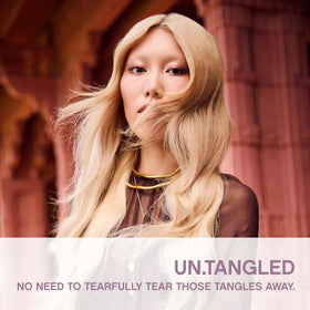 KEVIN.MURPHY UN.TANGLED spray application demonstrating easy detangling and styling prep.