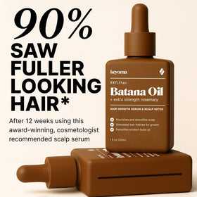 Applying Keyoma Batana Oil on hair for smoother, stronger strands.