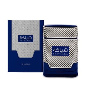 Khadlaj Shiyaaka Blue bottle side view features sleek blue-platinum finish.