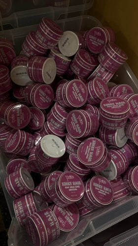 KhalidaNaturals edge control close-up shows flake-free formula for smooth, defined edges.