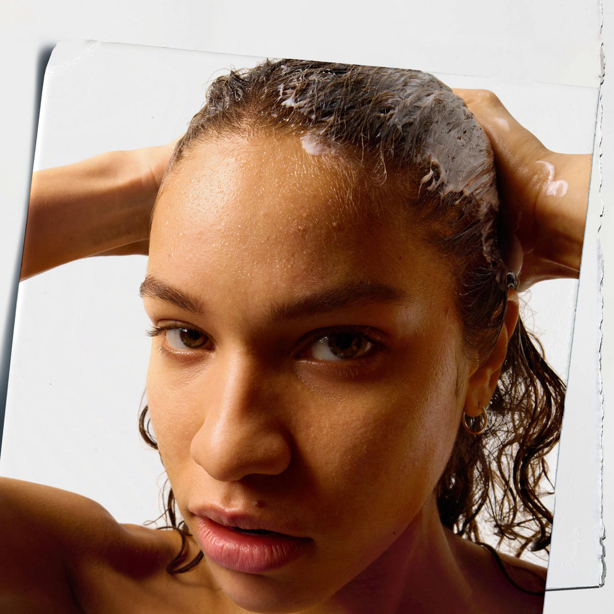 Kiehl's Amino Acid Conditioner on wet hair for easy two-minute treatment.