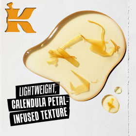 Kiehl's Calendula Toner applied with cotton pad to balance oil on skin.