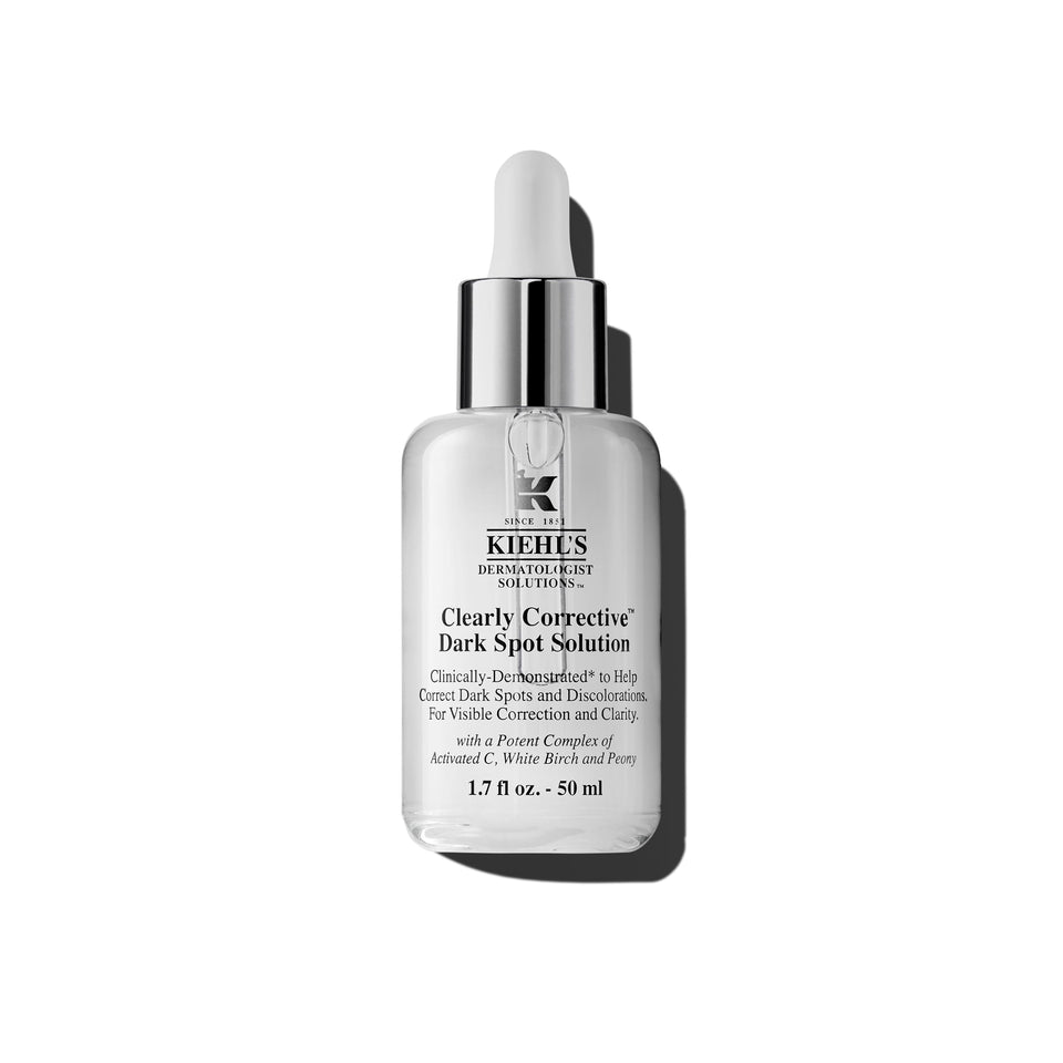 Kiehl's Clearly Corrective serum bottle close-up shows brightening formula.