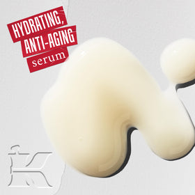 Applying Kiehl's Hyaluronic Acid Serum on the face for a quick hydration boost.