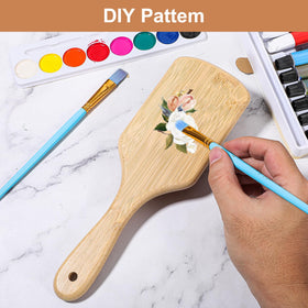 Kifmurase ergonomic wooden hair brush designed for comfortable grip during styling.