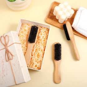 Kifmurase frizz-control brush distributes oils for a smoother look
