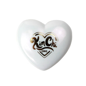 KimChiChic Pearl Gone Wild highlighter shoulders glow with sun kissed warmth